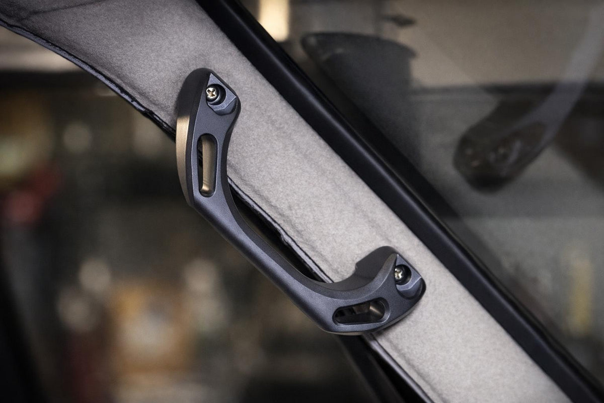 Installed Signal Grey billet A-pillar grab handle, blank version.
